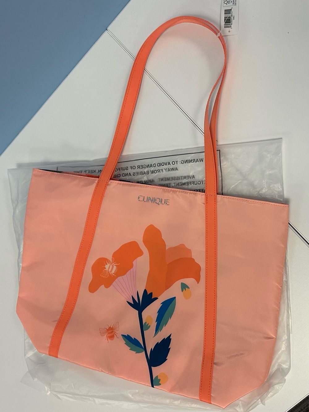 Brand New Clinique Coral-Peach Full Bloom Graphic Tote with Orange Straps